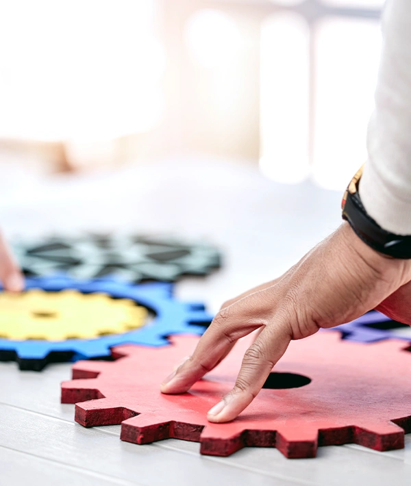 Interlocking colorful gears symbolizing operations and process design